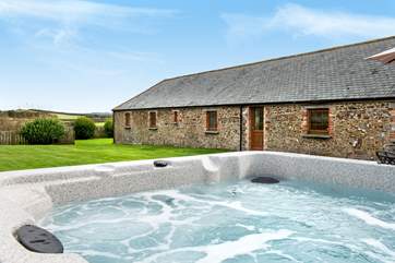 Enjoy time relaxing in the hot tub- what a treat!