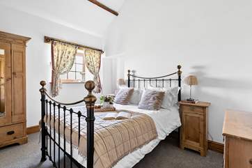 Bedroom 2 has a gorgeous brass bed and an en suite shower-room.