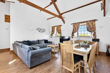 The open plan living/dining-room is beautifully furnished.