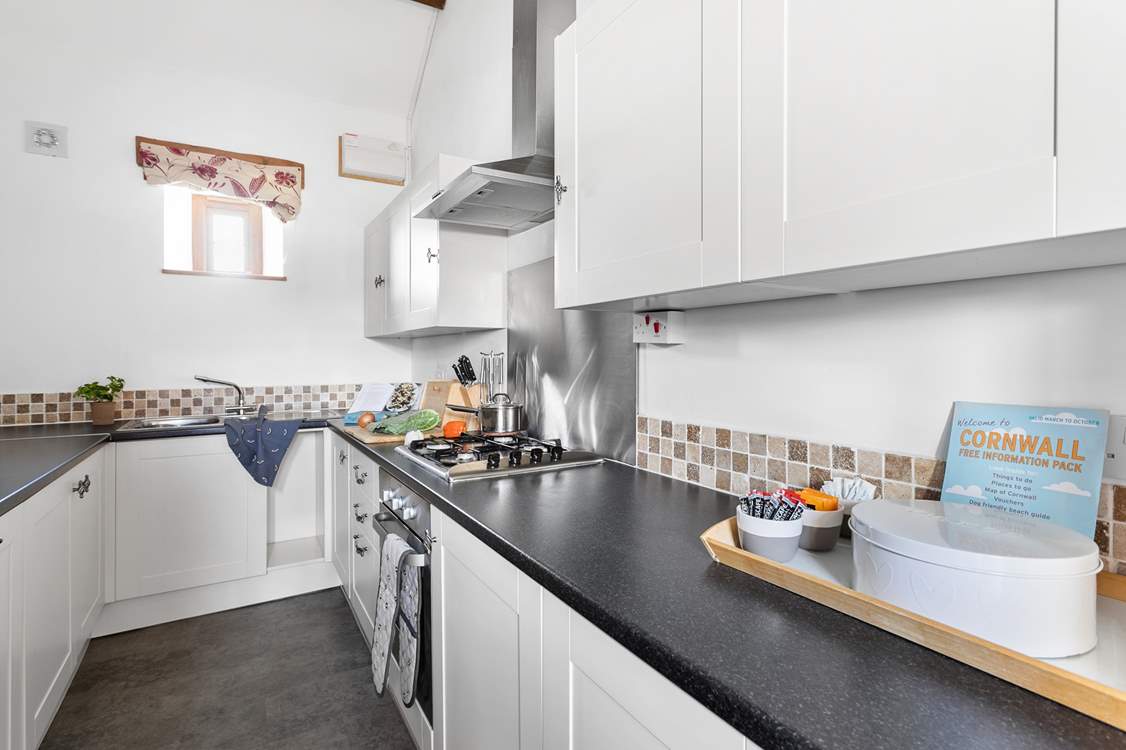 The galley kitchen has all that you need to cook up a treat.