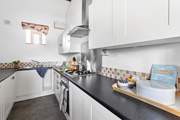 The galley kitchen has all that you need to cook up a treat.