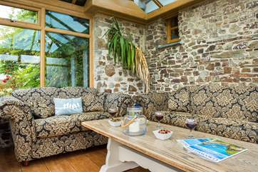 The conservatory leads off from the kitchen and can provide a quiet place to escape to.