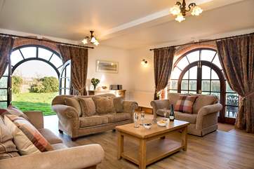 The large windows let the light flood in and allow easy acess to the garden.