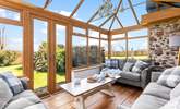 The sunny conservatory enjoys wonderful views over the garden. - Thumbnail Image