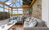 The conservatory leads off from the kitchen and can provide a quiet place to escape to. - Thumbnail Image