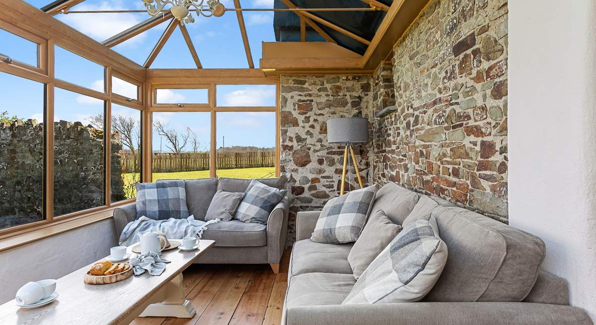 The conservatory leads off from the kitchen and can provide a quiet place to escape to.