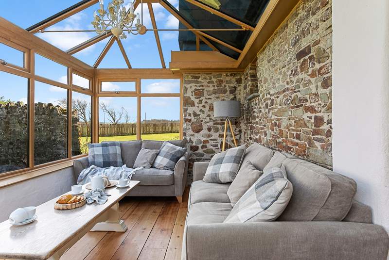 The conservatory leads off from the kitchen and can provide a quiet place to escape to.