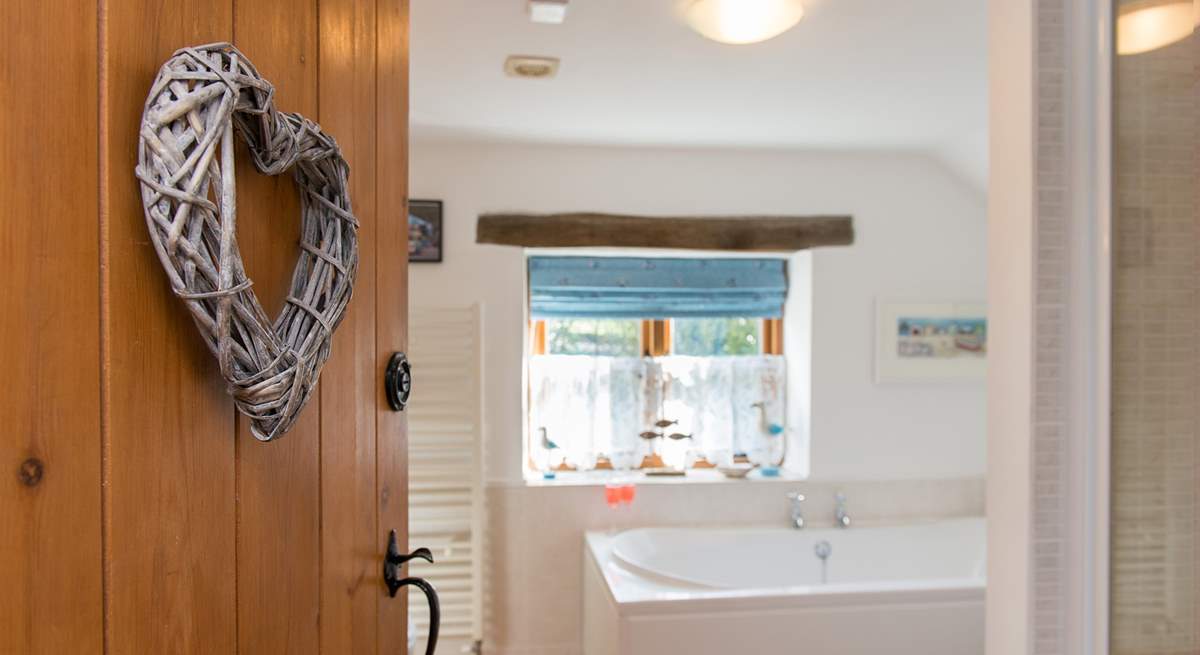 The bathroom leads off from the bedroom.