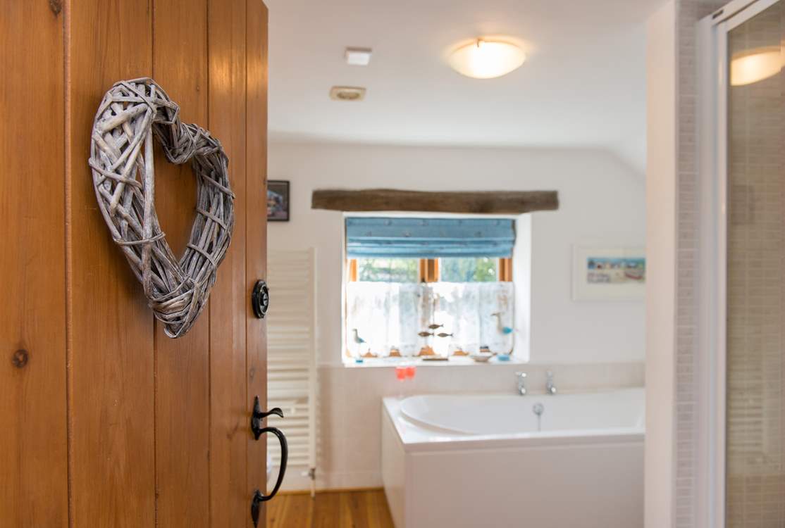 The bathroom leads off from the bedroom.
