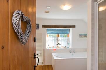 The bathroom leads off from the bedroom.