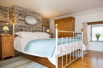 The bedroom is beautifully styled.