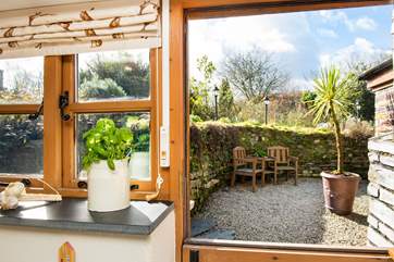 The stable-door leads out from the kitchen to the back garden.