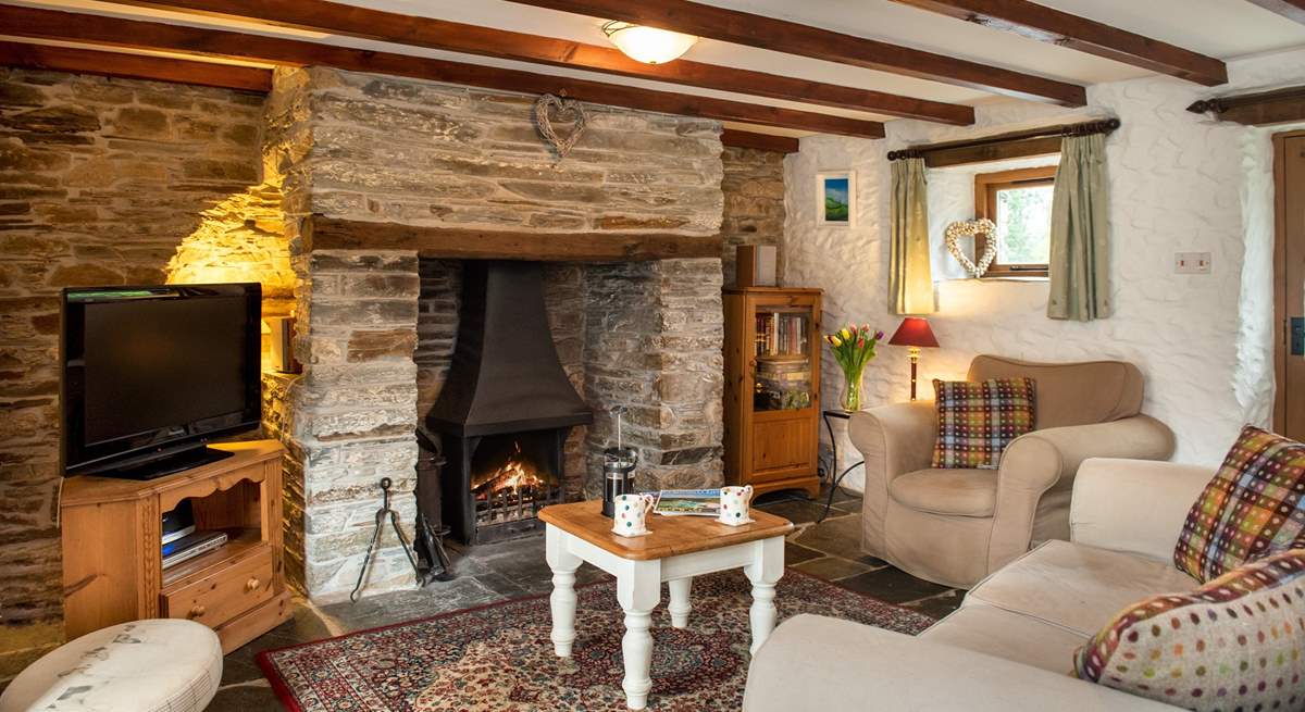 The sitting-room is snug and cosy and the wood-burner makes it an ideal retreat all year round.