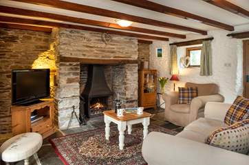The lounge is snug and cosy and the wood-burner makes it an ideal retreat all year round.