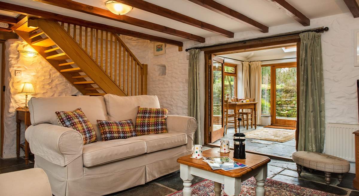 The cosy sitting-room leads out to the conservatory.