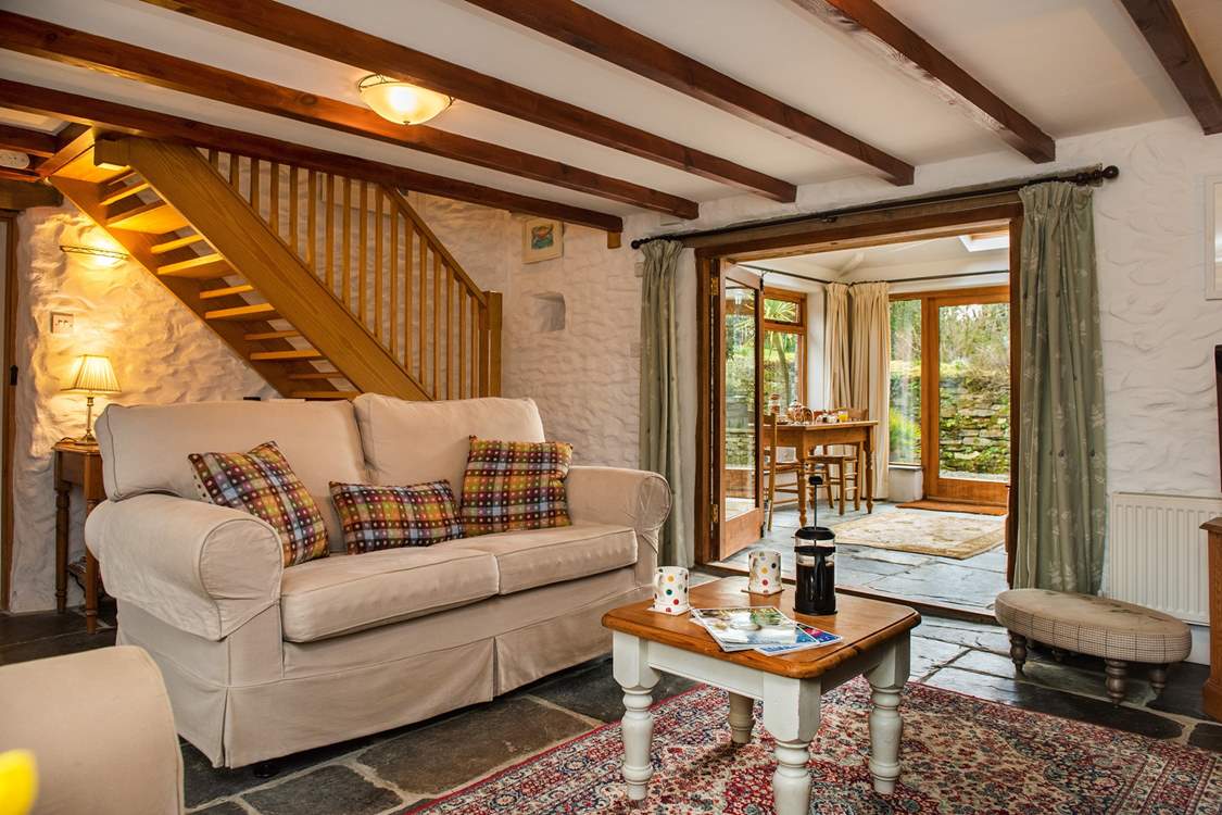 The cosy sitting-room leads out to the conservatory.