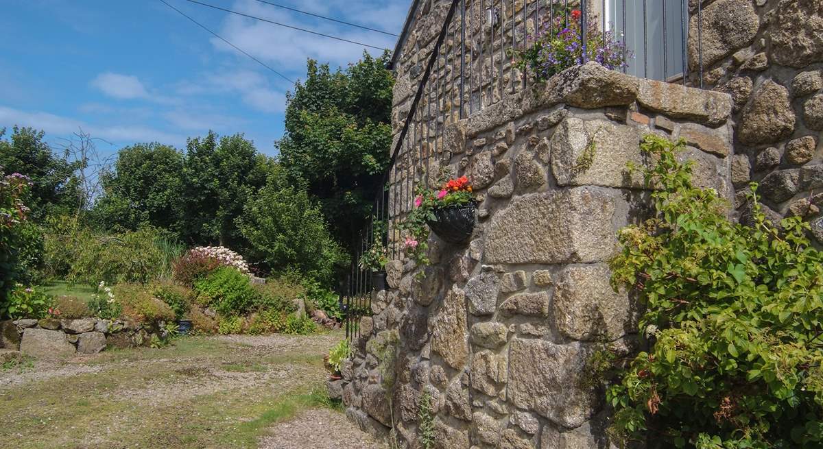 The pretty parking-area looking towards the garden, with granite steps to the front door.