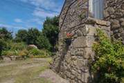 The pretty parking-area looking towards the garden, with granite steps to the front door.