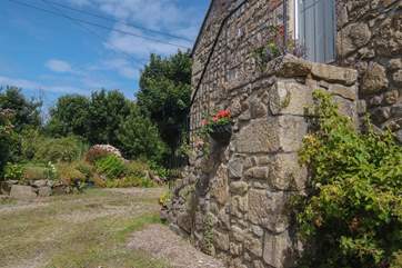 The pretty parking-area looking towards the garden, with granite steps to the front door.