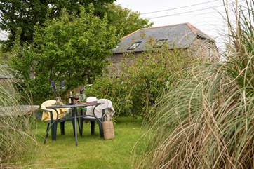 Enjoy meals al fresco in this sunny spot.