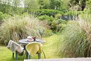 Enjoy al fresco dining in this sunny spot.