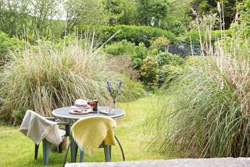 Enjoy al fresco dining in this sunny spot.