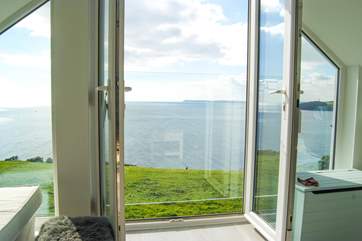 Doors in the living-room's gable end open to the view (with a safety glass screen).