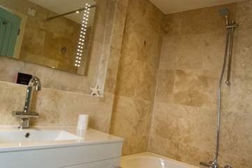 This bathroom is en suite to Bedroom 1.