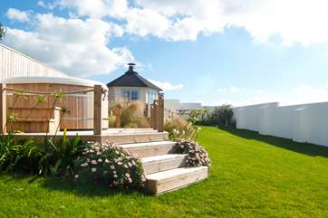 The cedar-clad hot tub is set on raised decking so you can relax and enjoy the wonderful views.