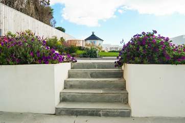 Five shallow steps lead up to the garden.