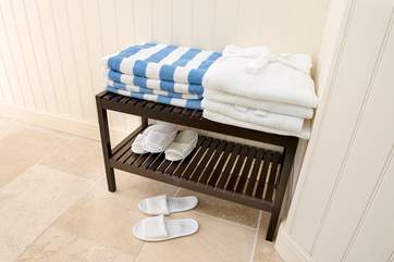 Fluffy robes, towels and slippers for when using the hot tub