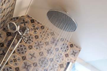 A drench head shower and a hand-held shower should do the job!