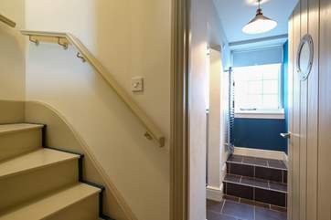 Stairs lead up to the living-room.