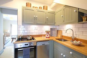 An open doorway leads from the kitchen to the living-room.