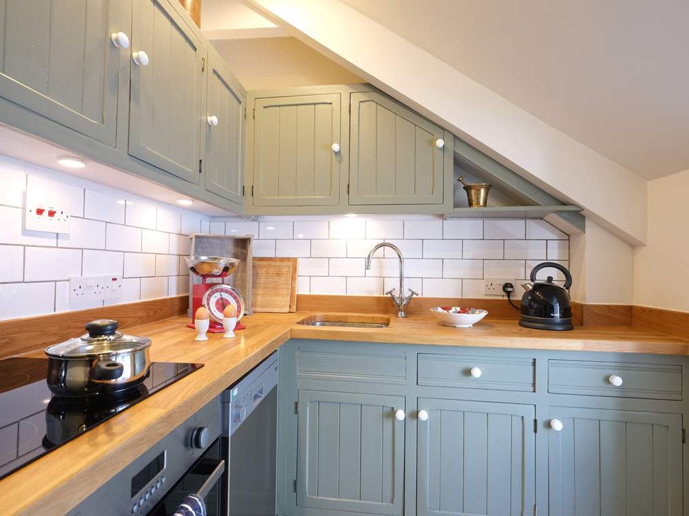 The kitchen has a sloping ceiling so please mind your head if you are tall.