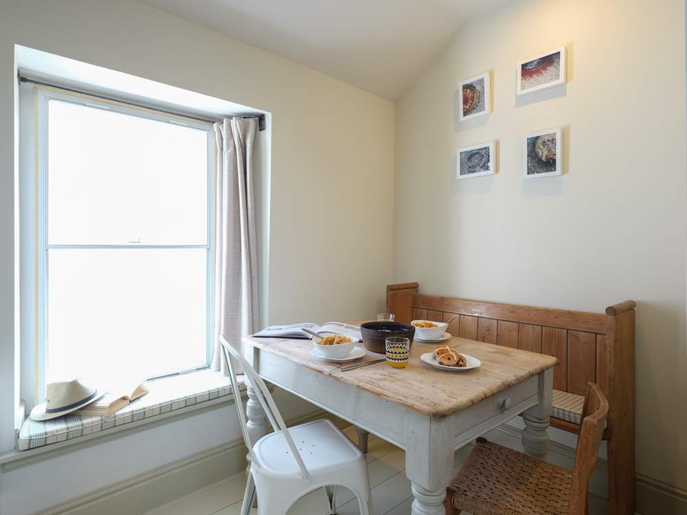 The dining-area with vintage scrubbed pine table.