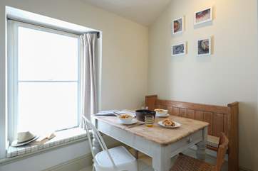 The dining-area with vintage scrubbed pine table.