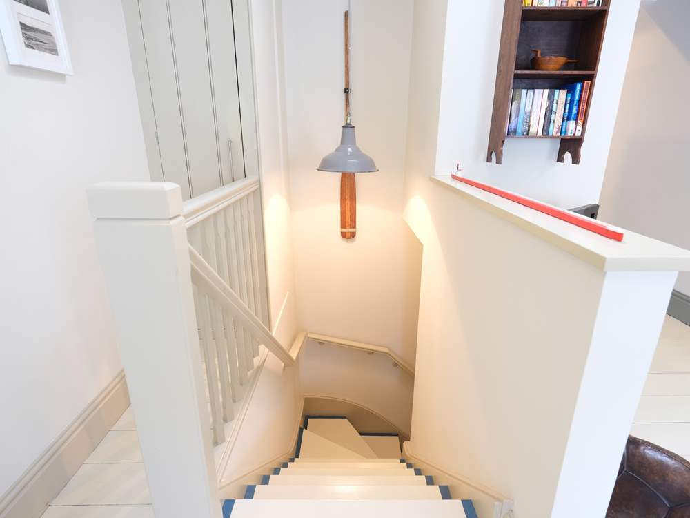 Stairs lead up from the bedroom to the living-room.