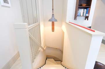 Stairs lead up from the bedroom to the living-room.