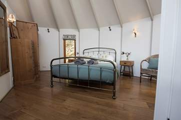The gorgeous king-size bed is situated in the main yurt.