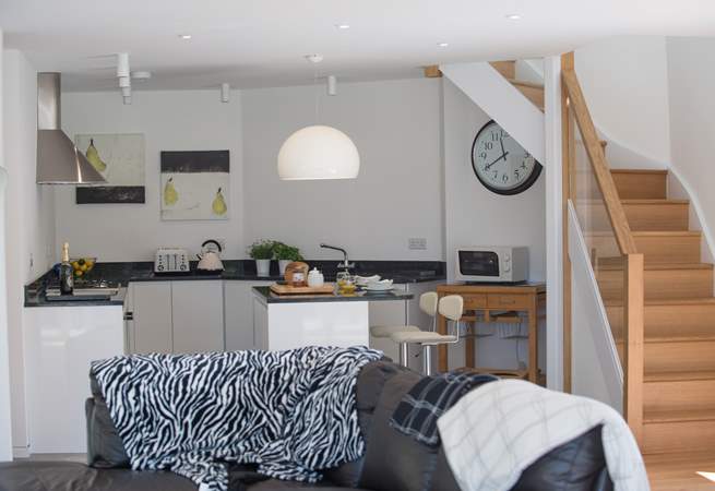 Stairs lead up from the living area.