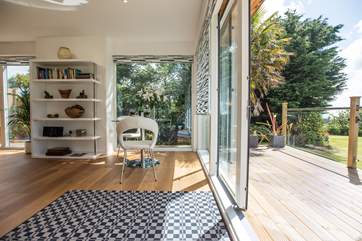 The sitting-area leads onto the lovely decked terrace.