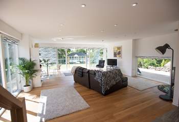 This lovely airy living space leads out to the garden.