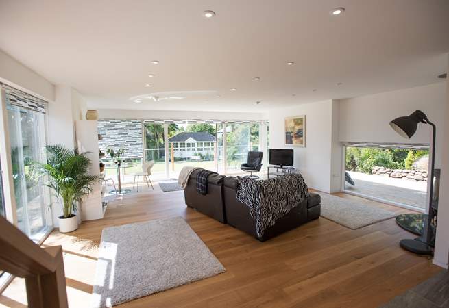 This lovely airy living space leads out to the garden.