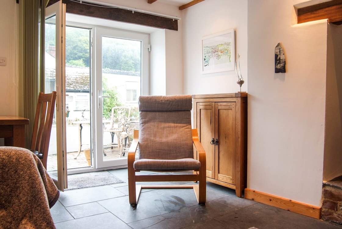 Doors open onto a little patio-area at the front of the cottage.