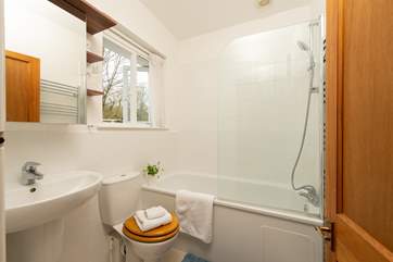 The family bathroom has a bath and a fitted shower.