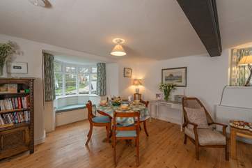 The window seat is another lovely feature in this welcoming cottage