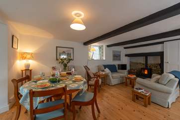 The cottage has a very spacious living/dining room with a huge fireplace and woodburning stove.