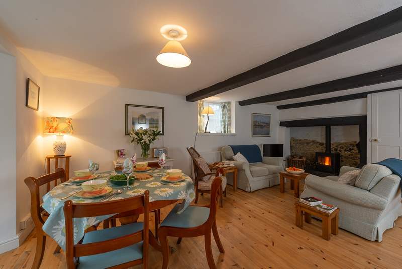 The cottage has a very spacious living/dining room with a huge fireplace and woodburning stove.
