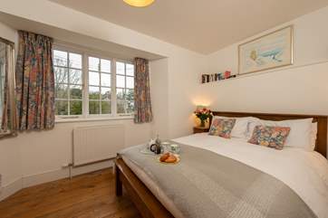 This is the master bedroom. There is a lovely view over the river to the nature reserve on the other side, and up the hill ito the heart of the historic village